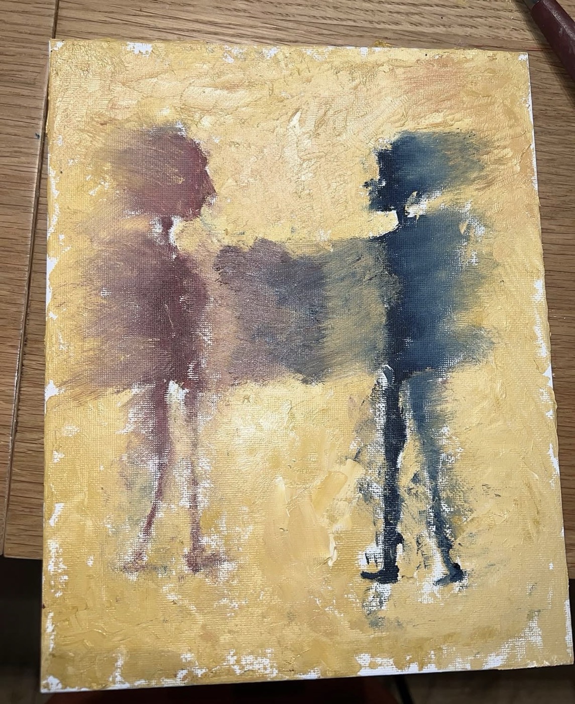 Abstract painting of two figures reaching toward each other on a warm yellow ground